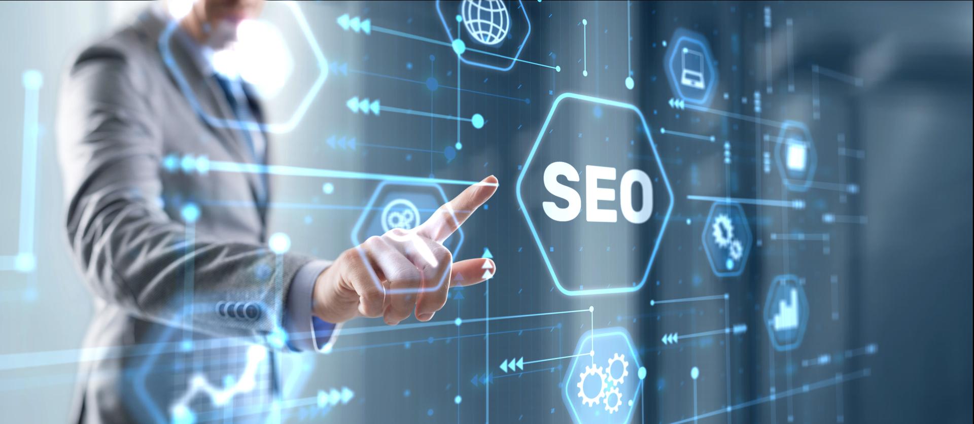 Businessman's fingers pressing a button SEO. Search engine optimization