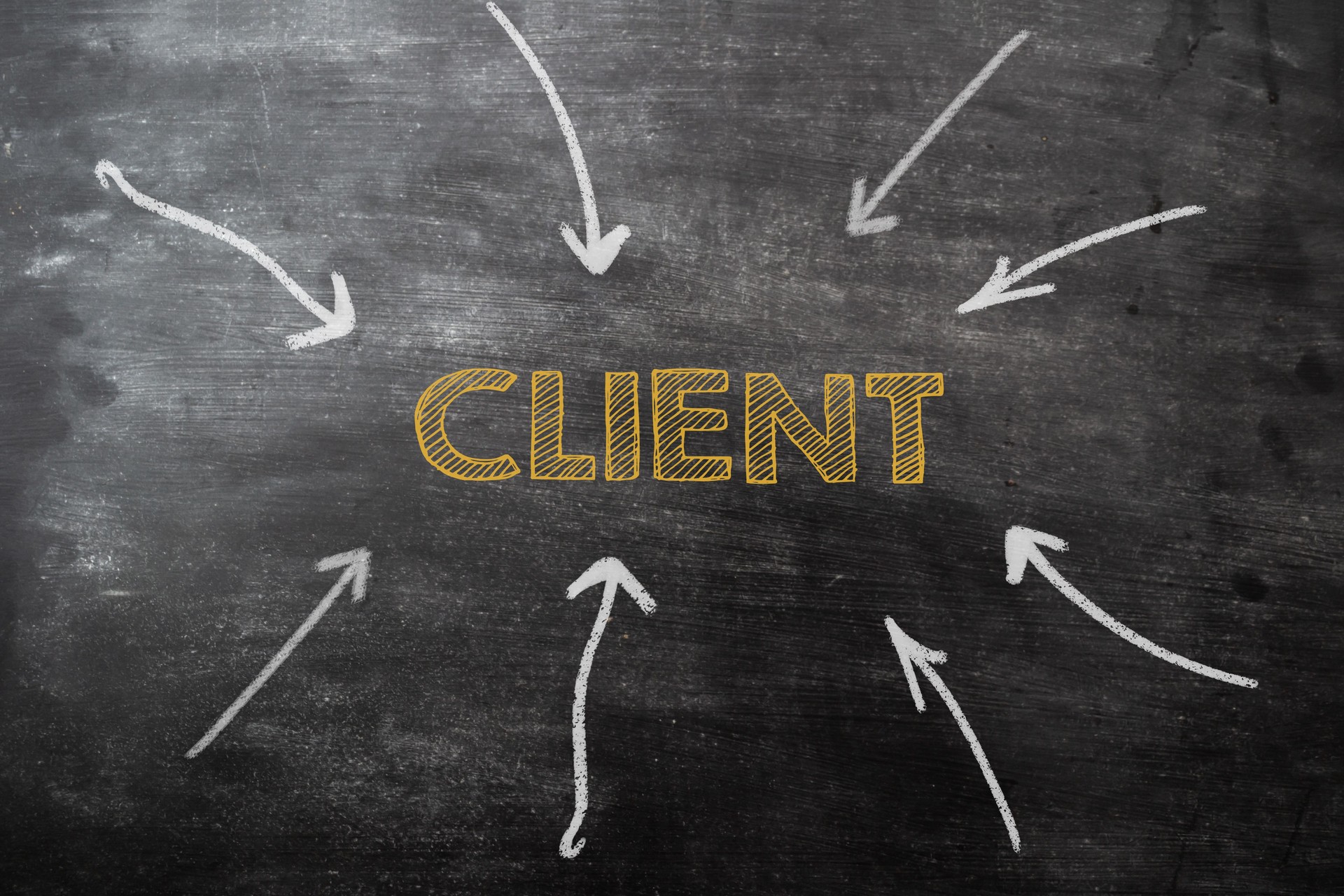 A chalkboard with arrows pointing to the word client in the center